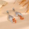 Gold leaf earrings close up