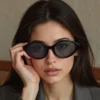 Elegant retro UV400 oval sunglasses with black frame and dark lenses